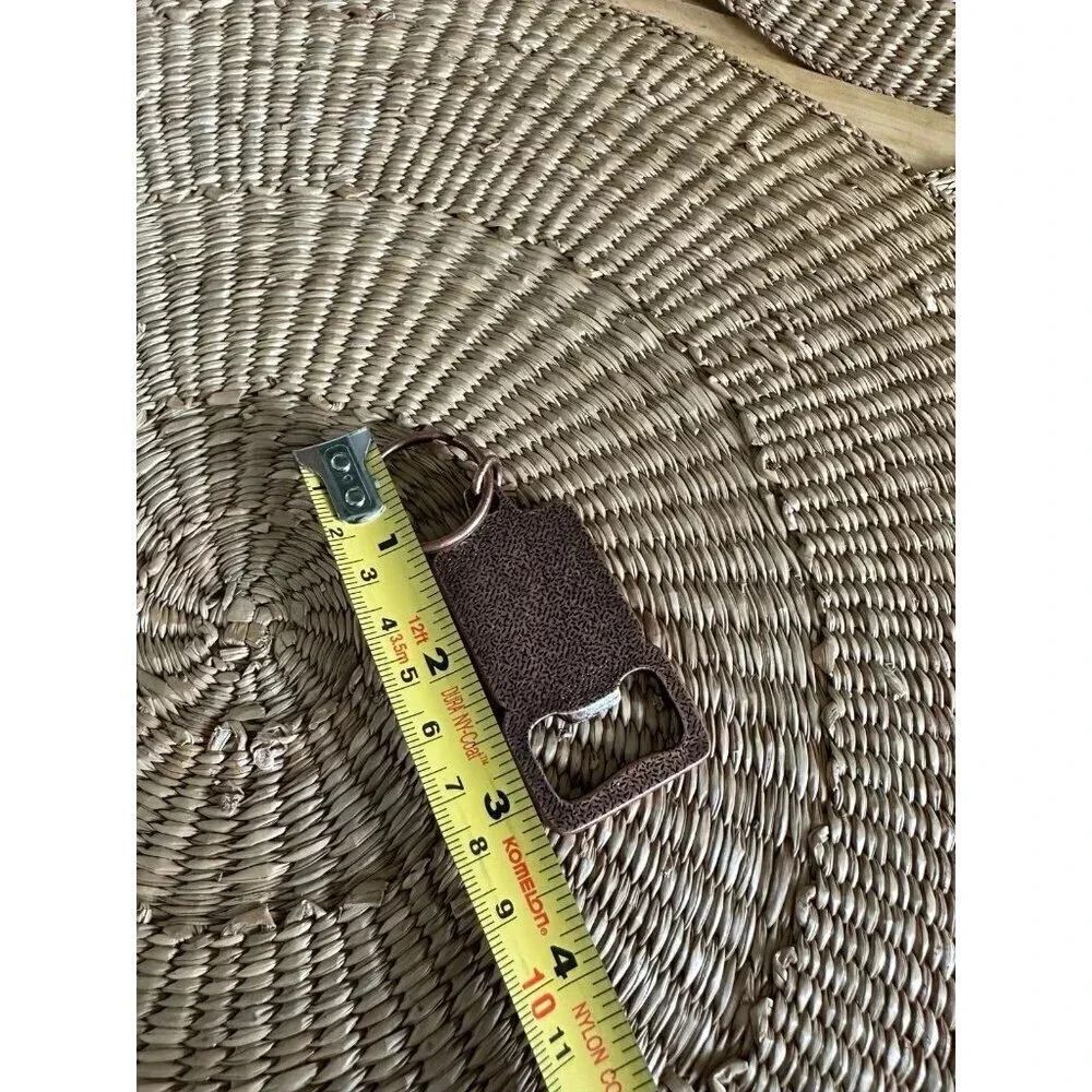 The Lodge metal bottle opener